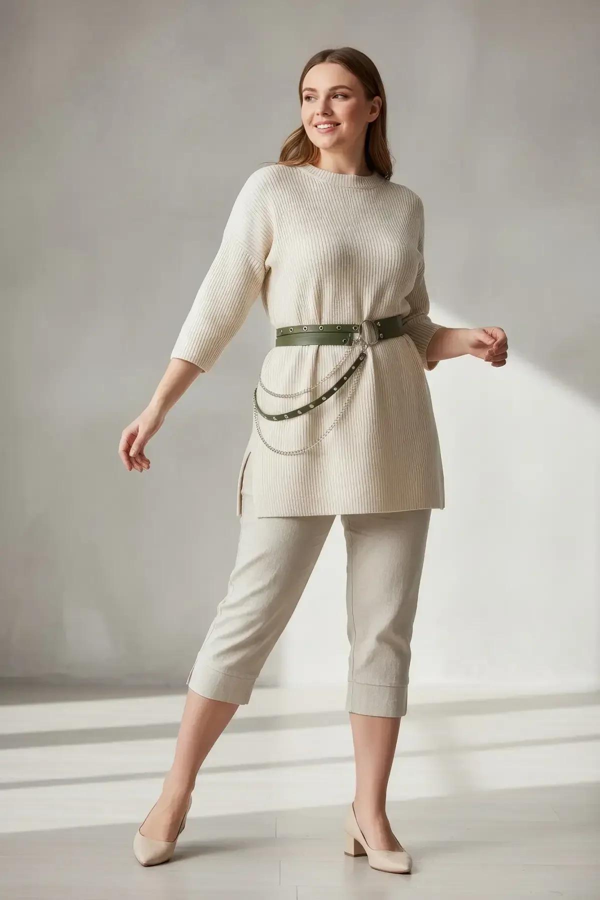 Olive green faux leather waist belt harness with silver eyelet row and central O-ring hardware close-up