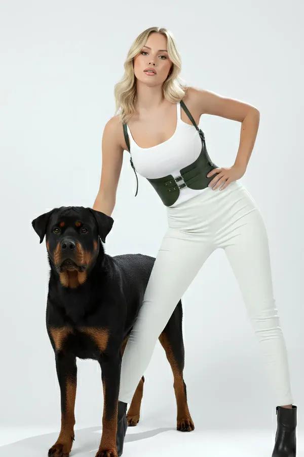 Olive green faux leather underbust harness waist cincher with double silver buckles and adjustable shoulder straps worn over 