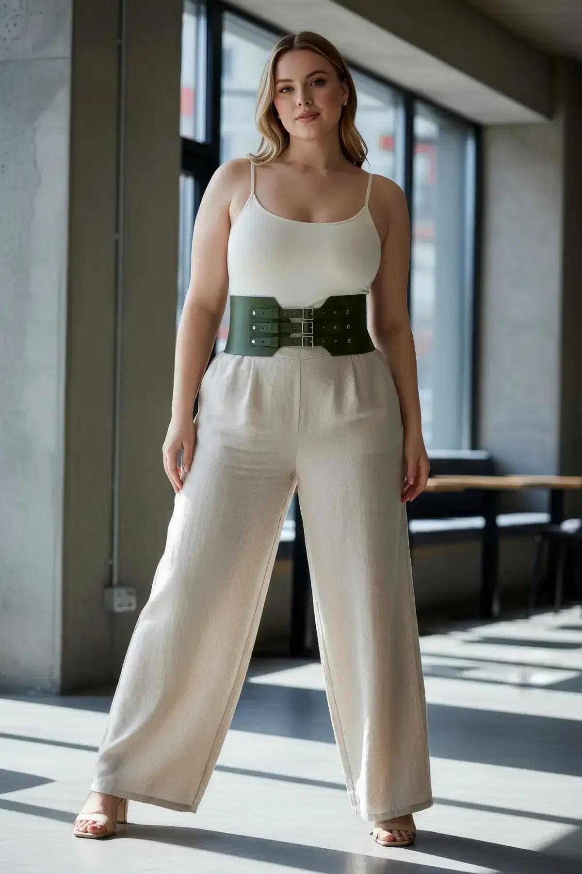 side profile of wide olive waist cincher paired with pleated midi skirt casual outfit