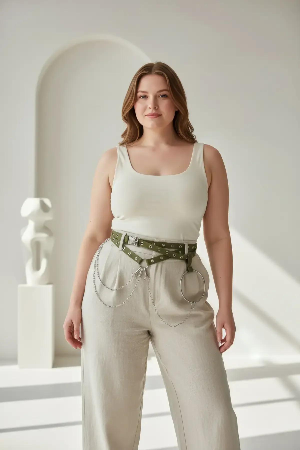 Close-up of olive faux leather belt band showing dual silver eyelet rows and pin-buckle closure detail