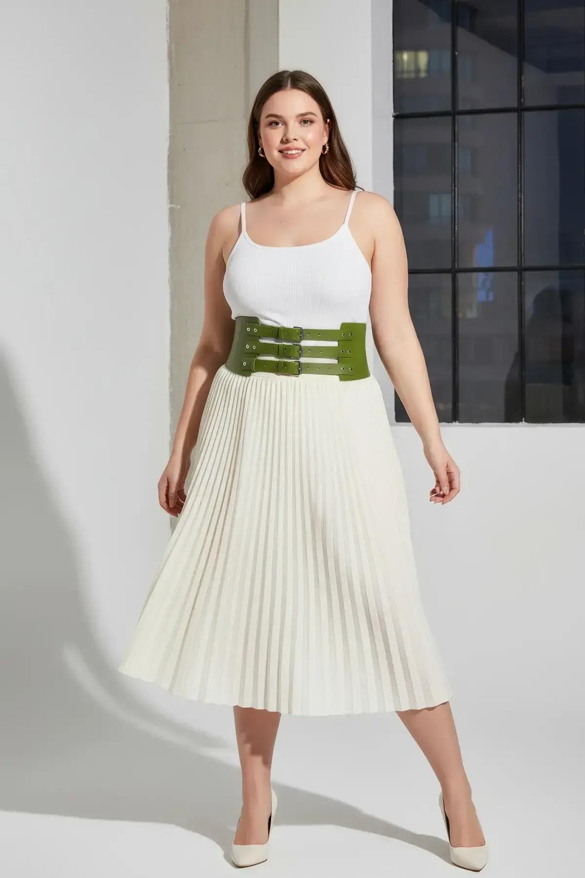back view of olive green wide faux leather waspie belt single-piece panel sitting flat at waist