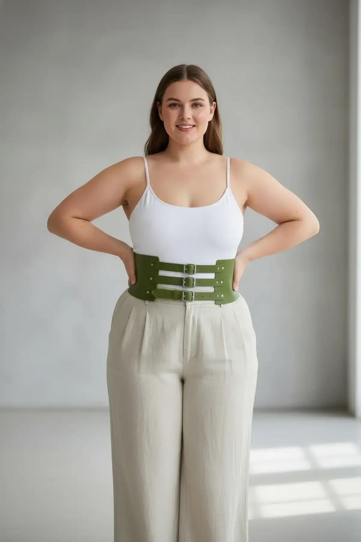 olive green waspie belt styled over cream linen shirt and wide-leg trousers full outfit view