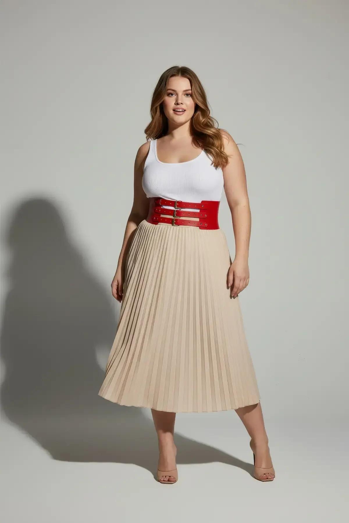 Red wide waist harness styled over white button-down shirt with black trousers