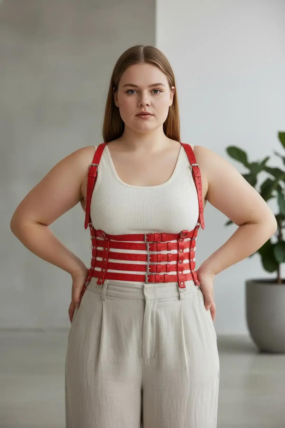 Red multi-strap harness showing adjustable shoulder and waist bands from front view
