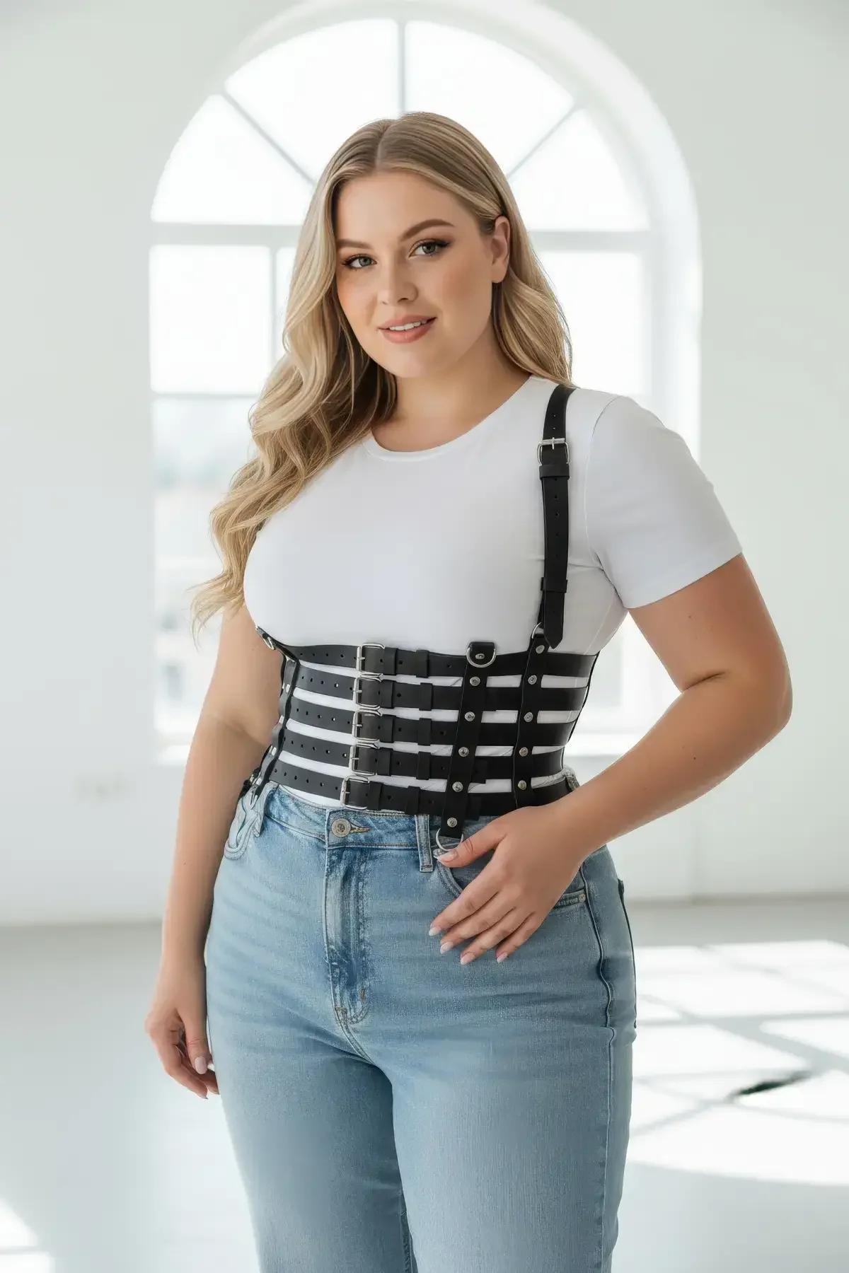 close-up of black faux leather waist cage bands with silver zinc-alloy flat-pin buckle closures