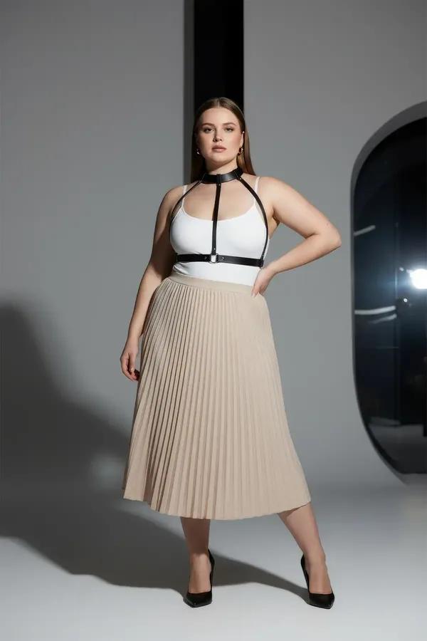 black faux leather body harness with choker collar and underbust band worn over white top plus size model