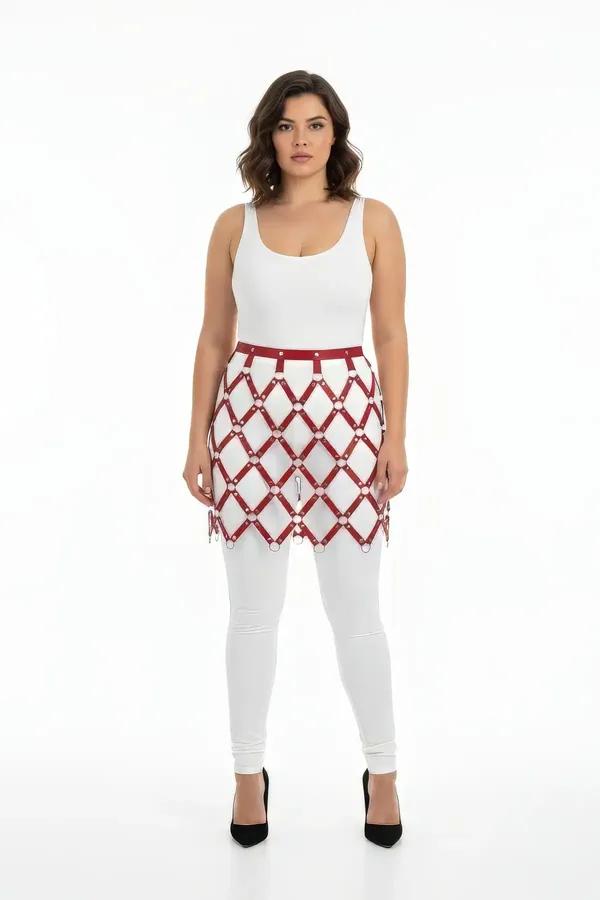 burgundy faux leather harness skirt with silver O-ring diamond grid overlay worn over white leggings