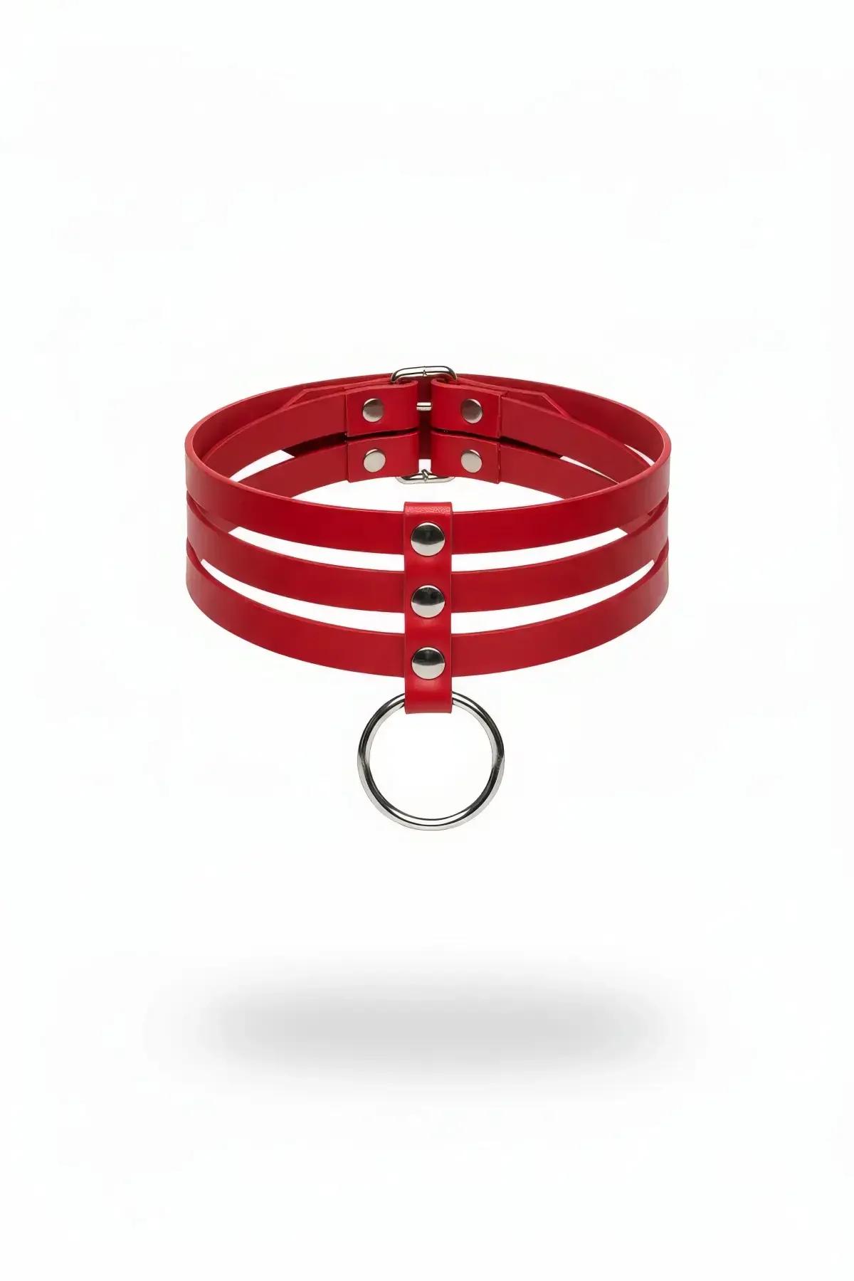 Red triple strap faux leather choker with silver rivets and hanging O-ring pendant on white background