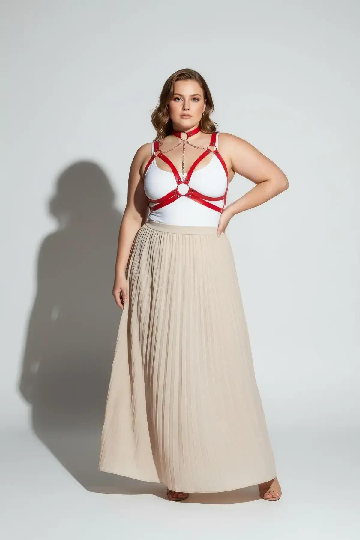 Red chest harness with decorative gold-tone chain draped between choker and bust straps