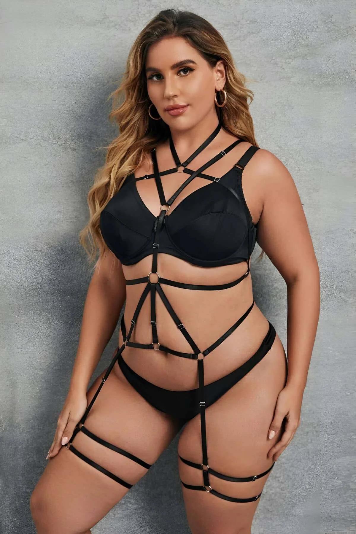 black elastic strap chest cage harness with gold O-ring at bust detail close-up
