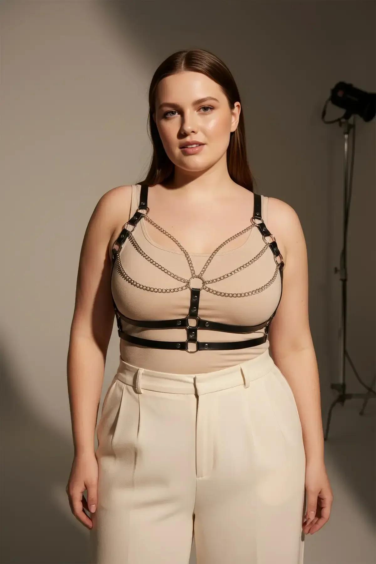 Adjustable black body harness with silver chain detail, side angle showing strap buckle adjustment