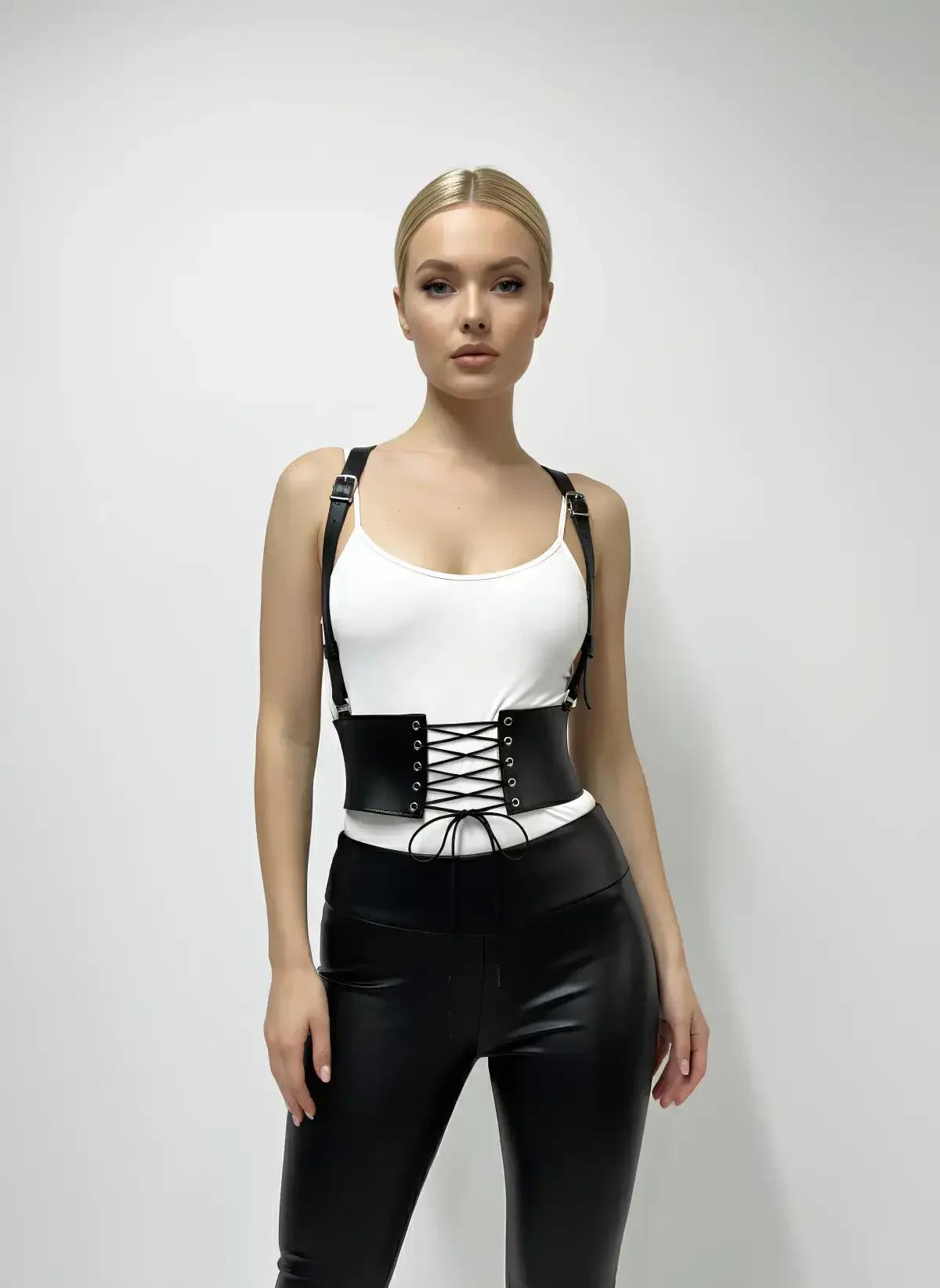 detail shot of silver square buckle connecting shoulder strap to black faux leather corset top
