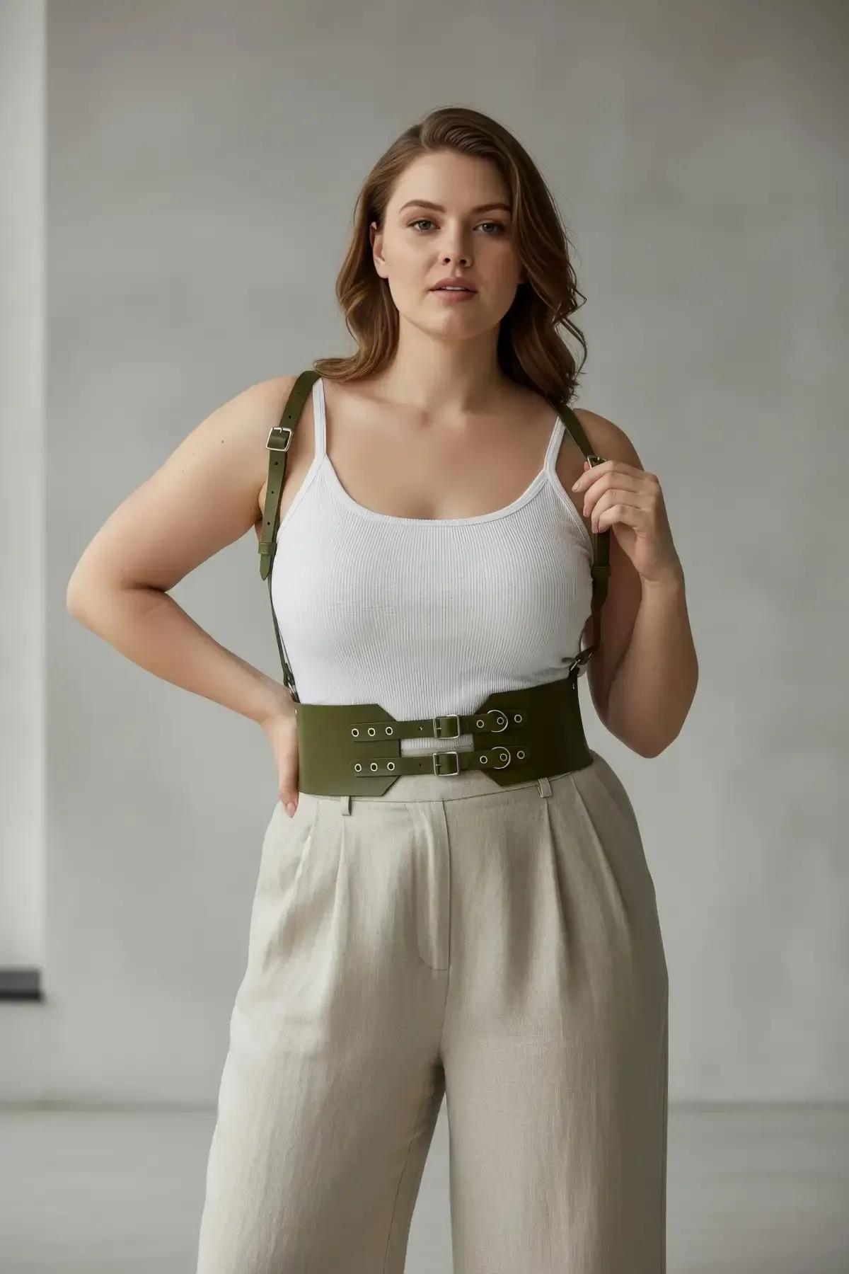 olive green PU leather wide waist harness showing D-ring side hardware and eyelet strap detail