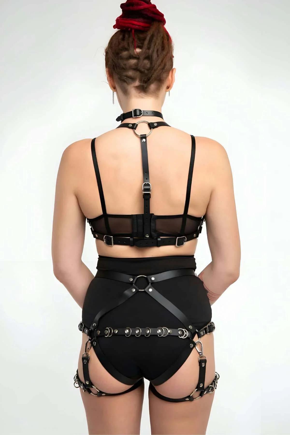 High-waist waist harness panel with five silver O-rings and garter straps, front view
