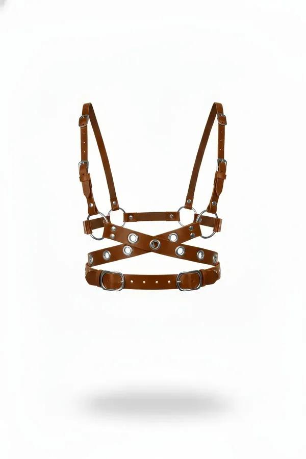 Tan faux leather criss-cross chest harness with silver O-rings, grommets, and dual D-ring waist buckles