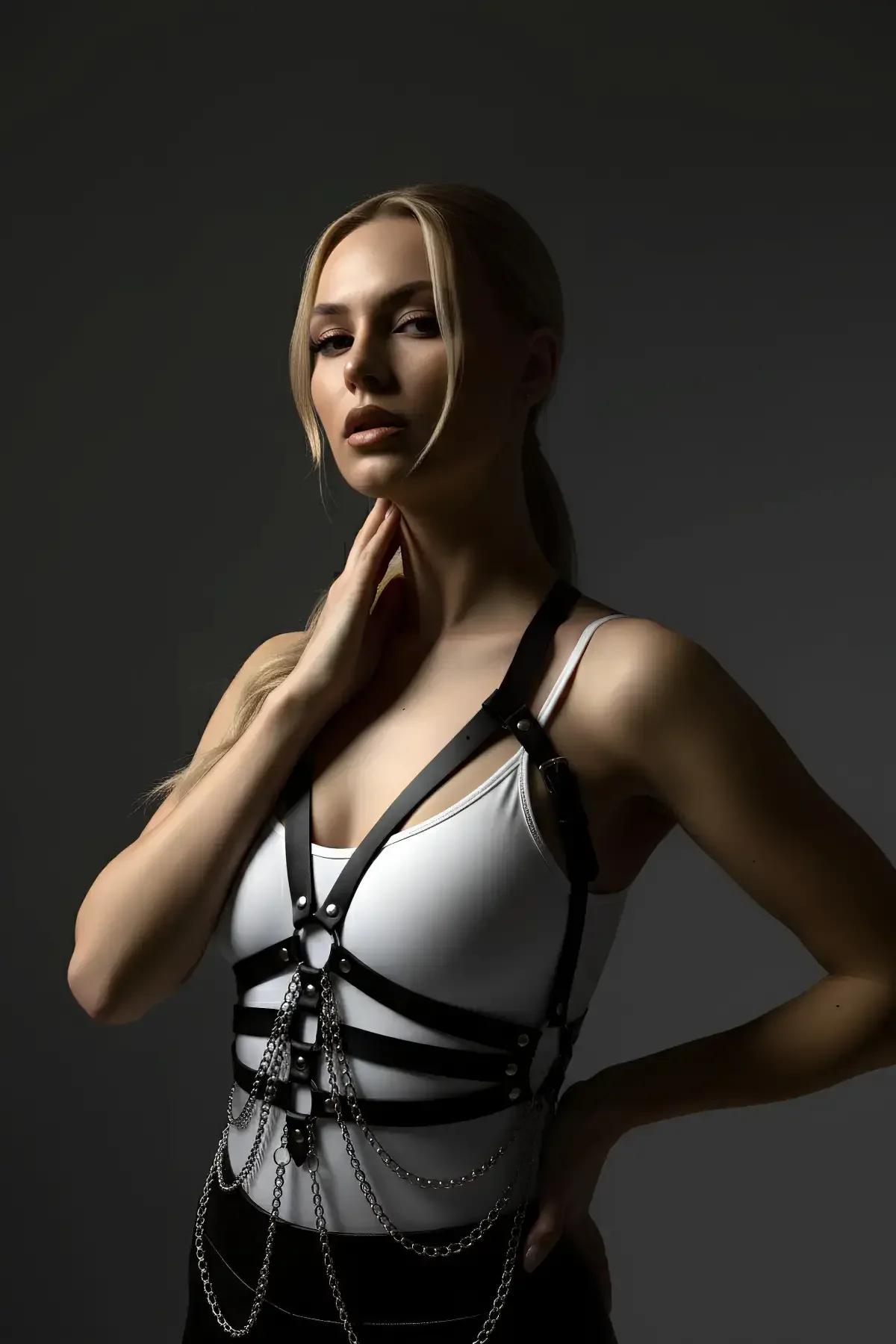 Adjustable strappy black harness with silver-tone square buckle hardware and multi-row chain cascade