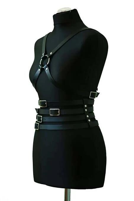 close-up of silver-tone rectangular buckles on black faux leather waist straps
