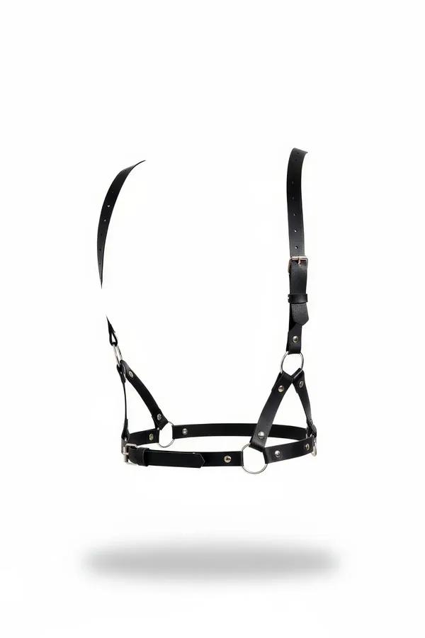 black vegan leather chest harness with silver O-rings and adjustable straps on white background