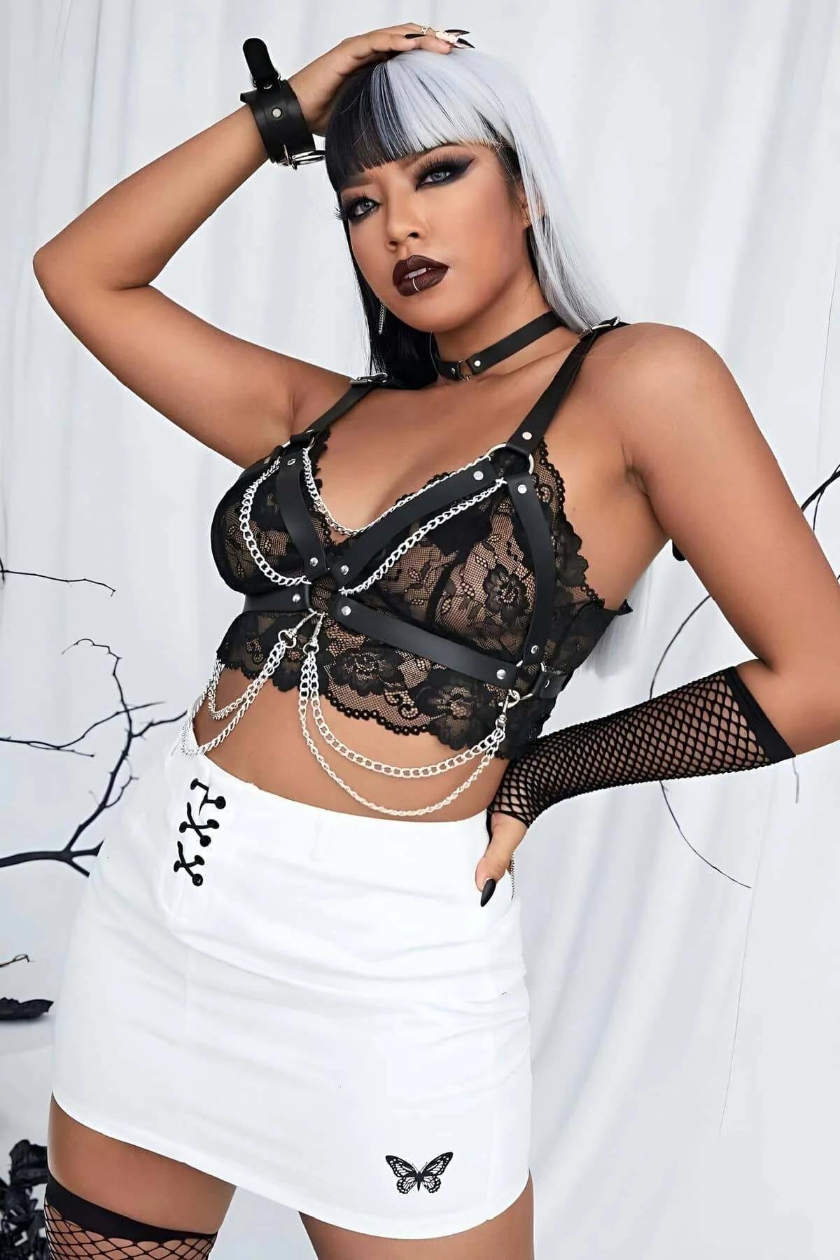 back view of black faux leather chest harness showing smooth strap construction and D-ring buckles