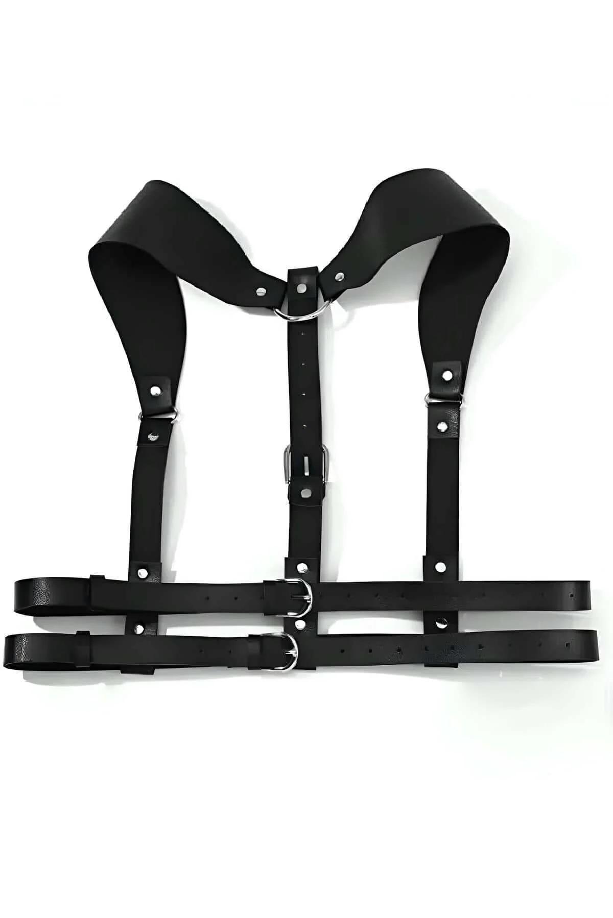 close-up of silver-tone pin buckle and rivet hardware on black faux leather harness strap