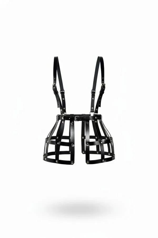 Black faux leather cage skirt harness with adjustable shoulder straps and silver rivet hardware on white background