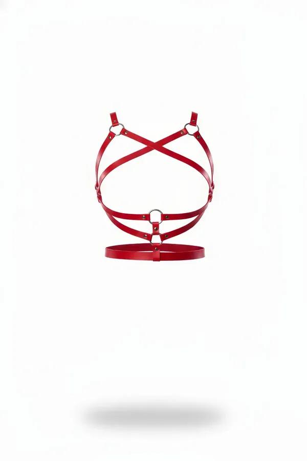 Red faux leather chest harness with criss-cross straps and three silver O-rings on white background