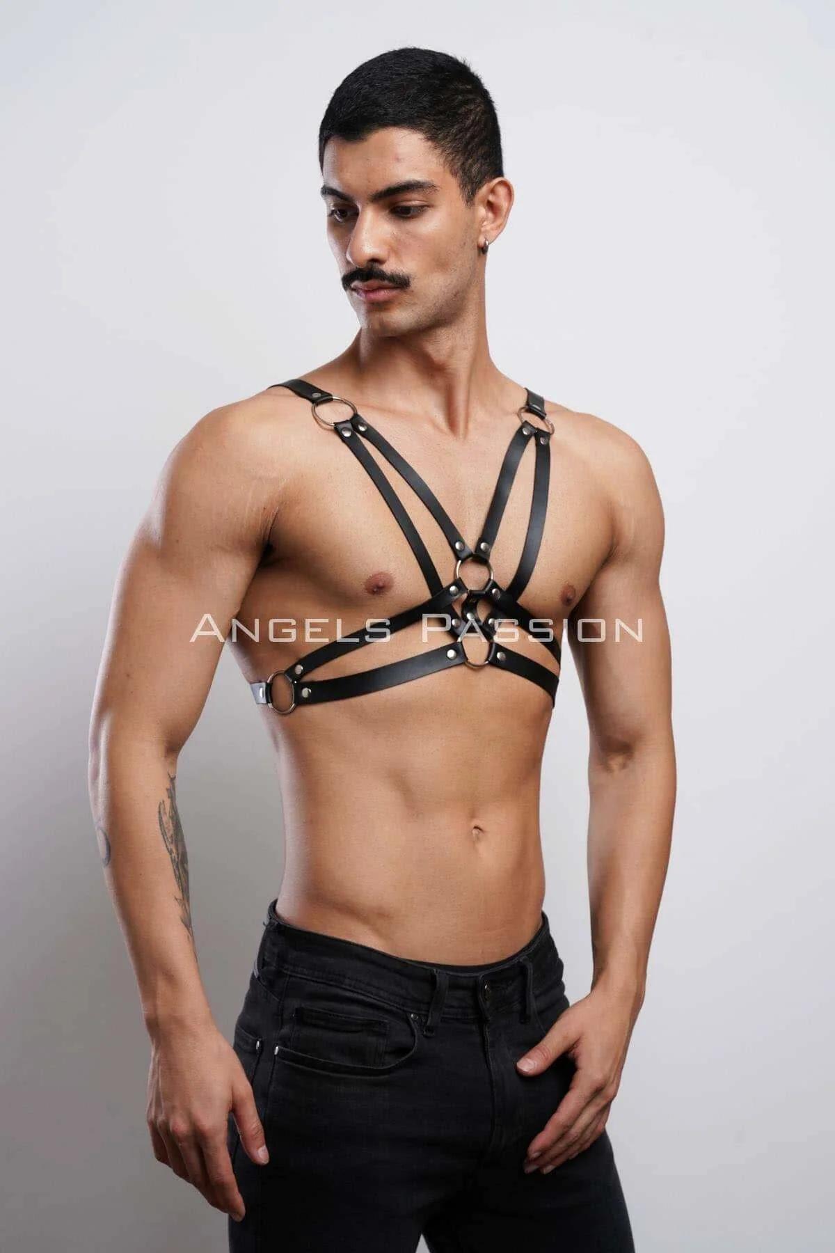 Flat lay of black strappy O-ring chest harness showing full strap layout and six O-rings