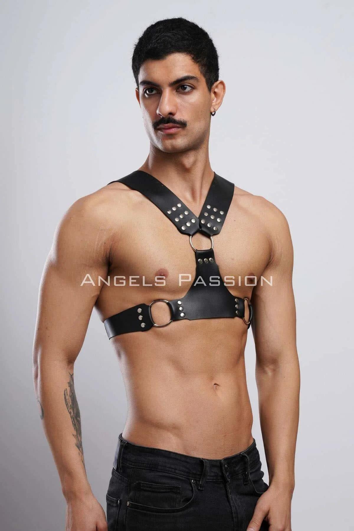 detail of gold-tone zinc alloy O-rings on horizontal waist band of black chest harness