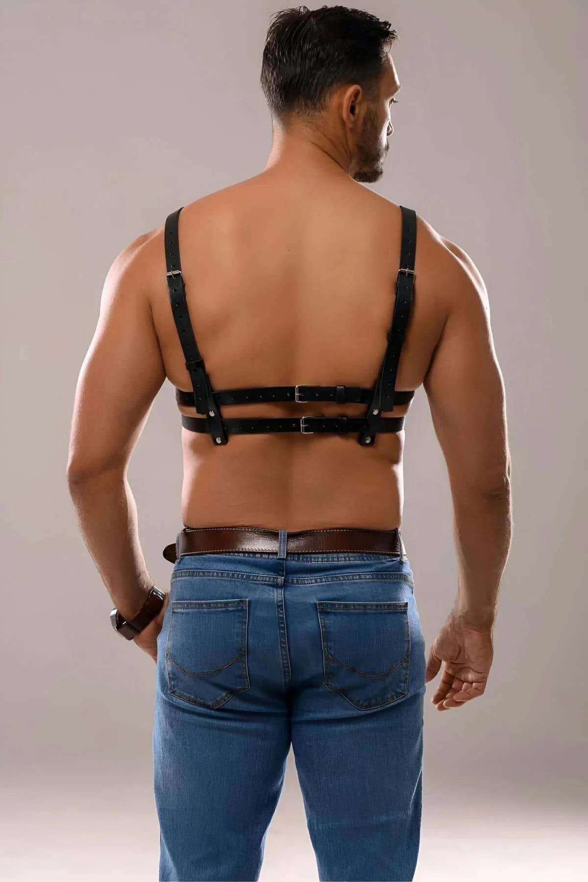 black strappy chest harness double band detail on bare torso streetwear styling
