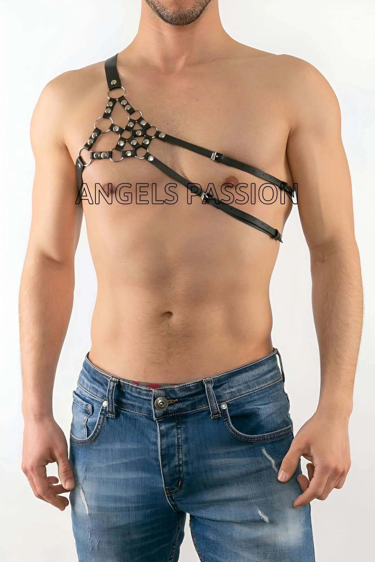 Close-up of silver dome stud grid on black faux leather one-shoulder panel