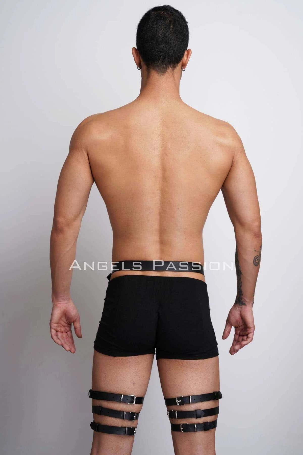 black triple strap leg harness styled over black shorts showing full mid-body layering effect