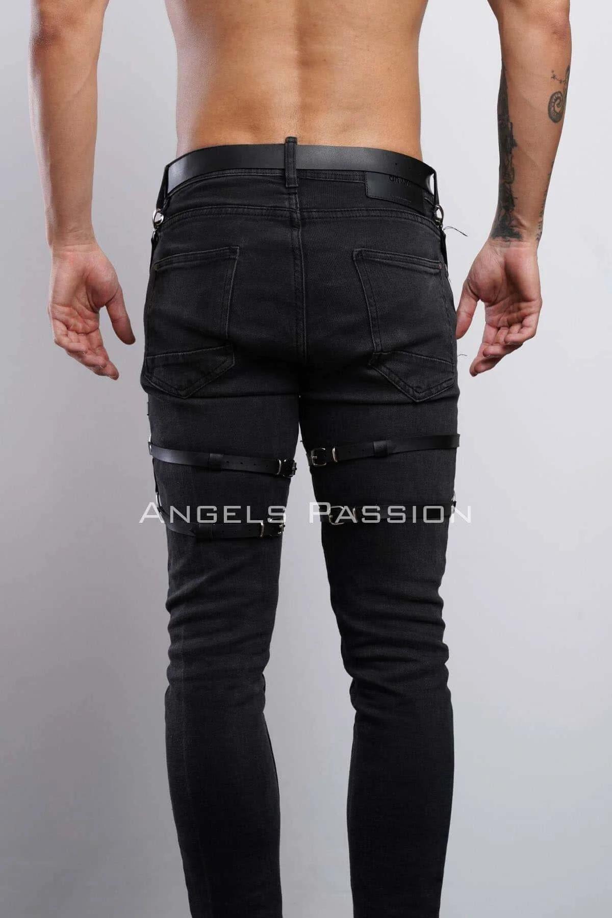 full-length view of black leg harness on black jeans showing hip-to-knee strap configuration
