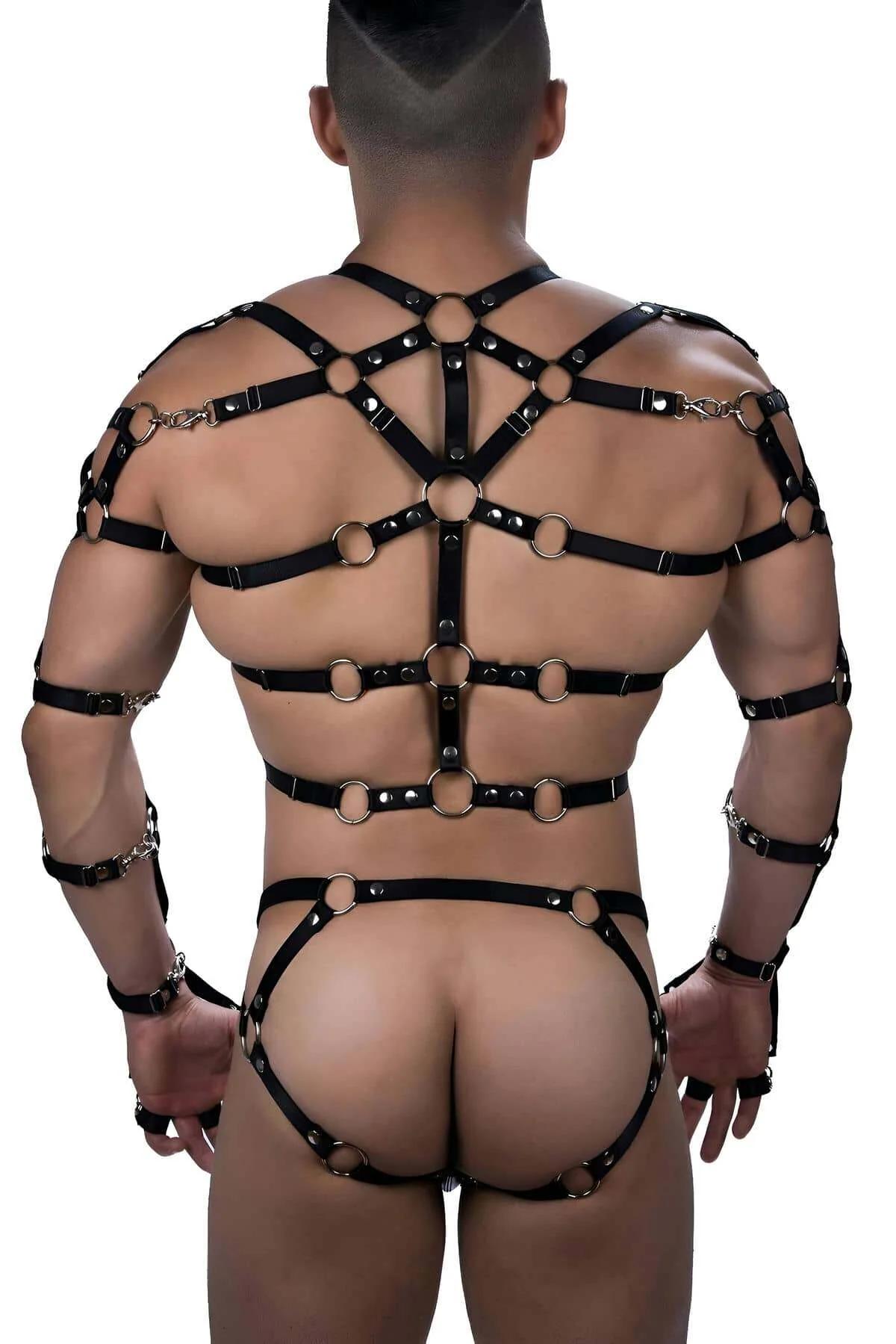 Black PU leather cage arm sleeve harness with silver stud rivets and O-ring wrist connectors detail