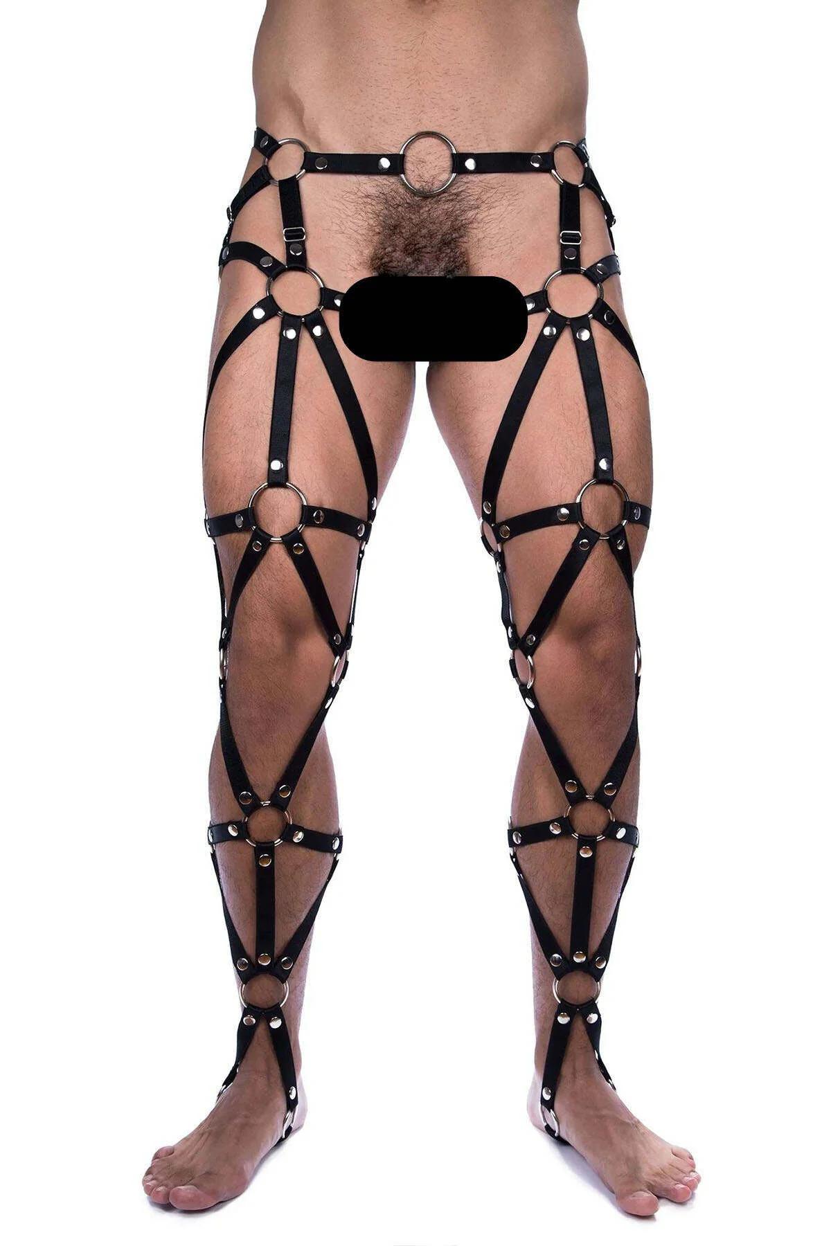 Waist and hip section of black strappy leg harness showing large central O-ring and slide buckles