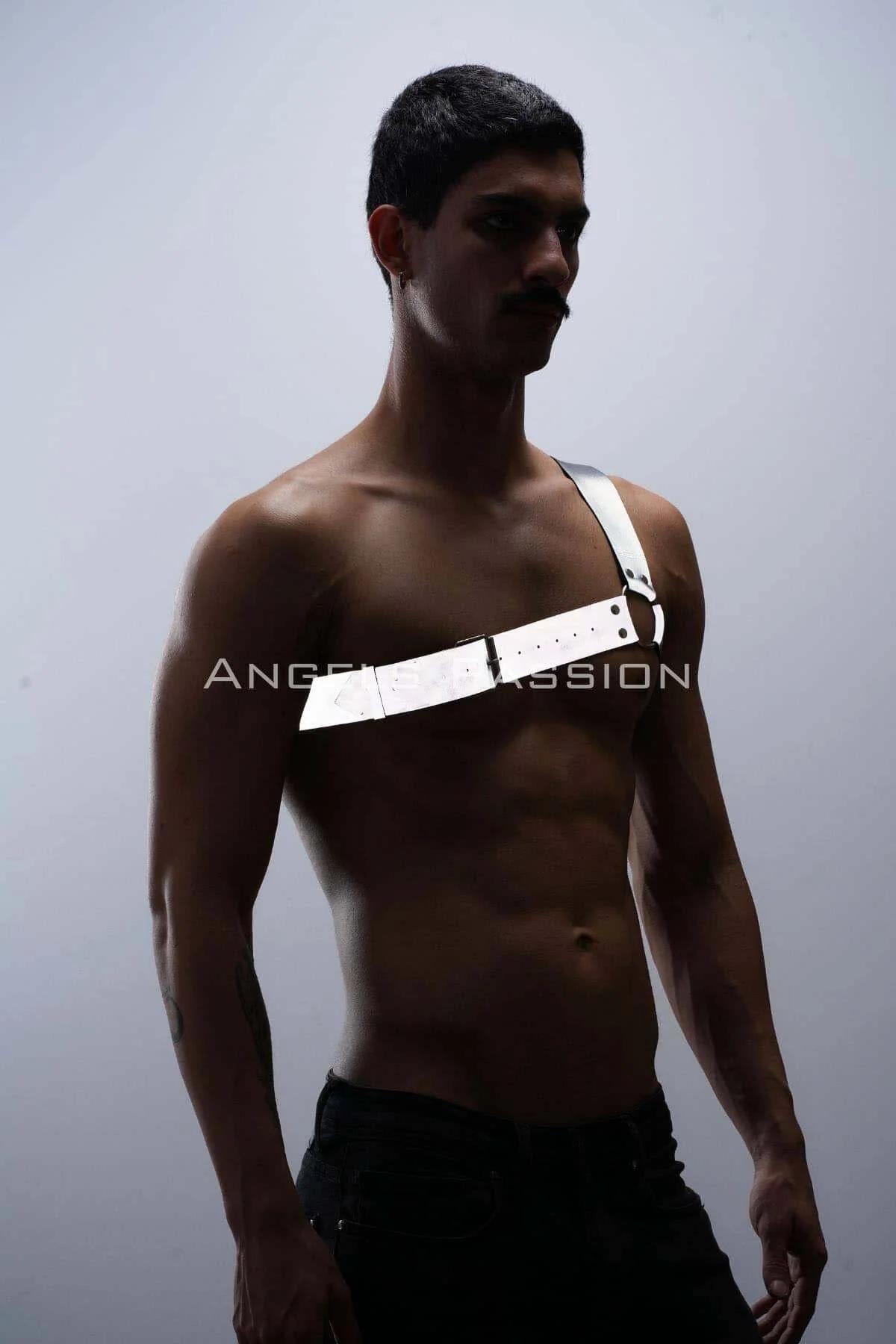Flat lay of white reflective one-shoulder harness displaying full strap layout and O-ring hardware