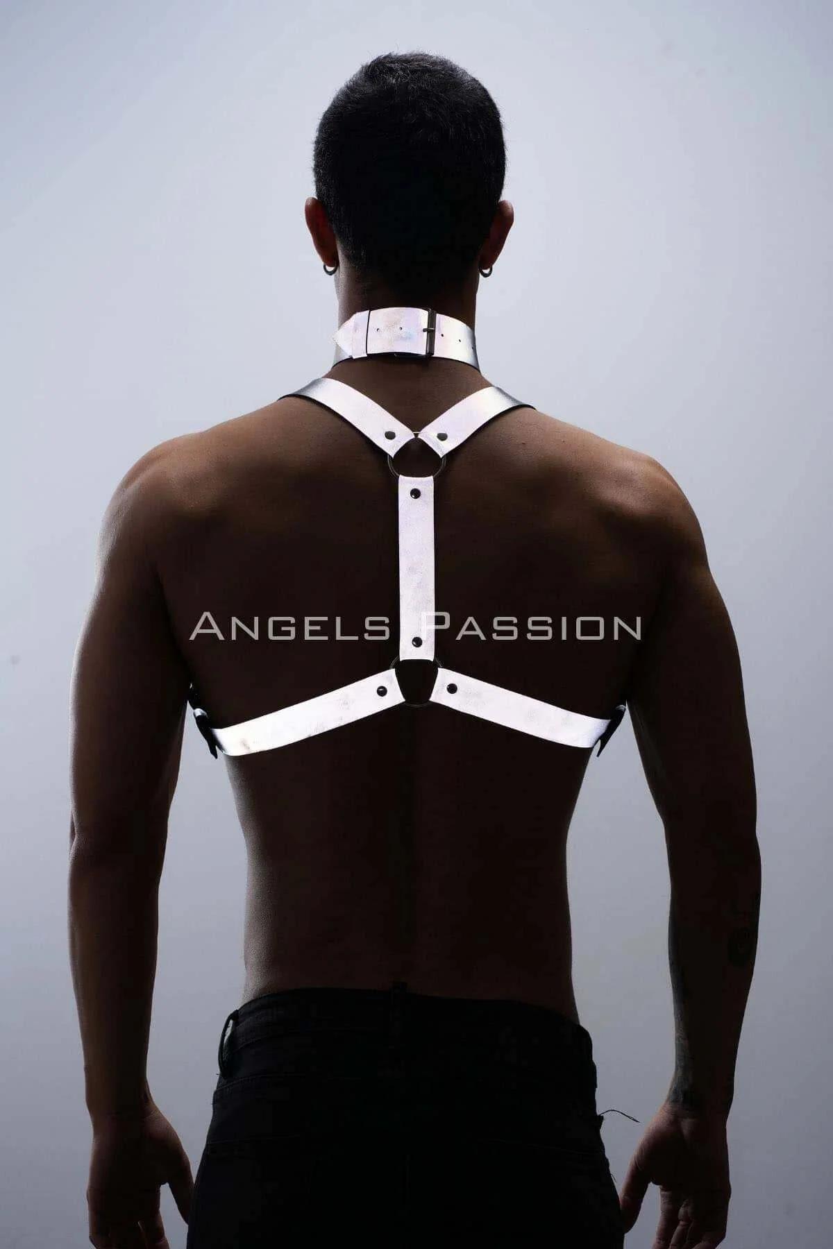 Diagonal strap configuration of white reflective faux leather body harness on torso