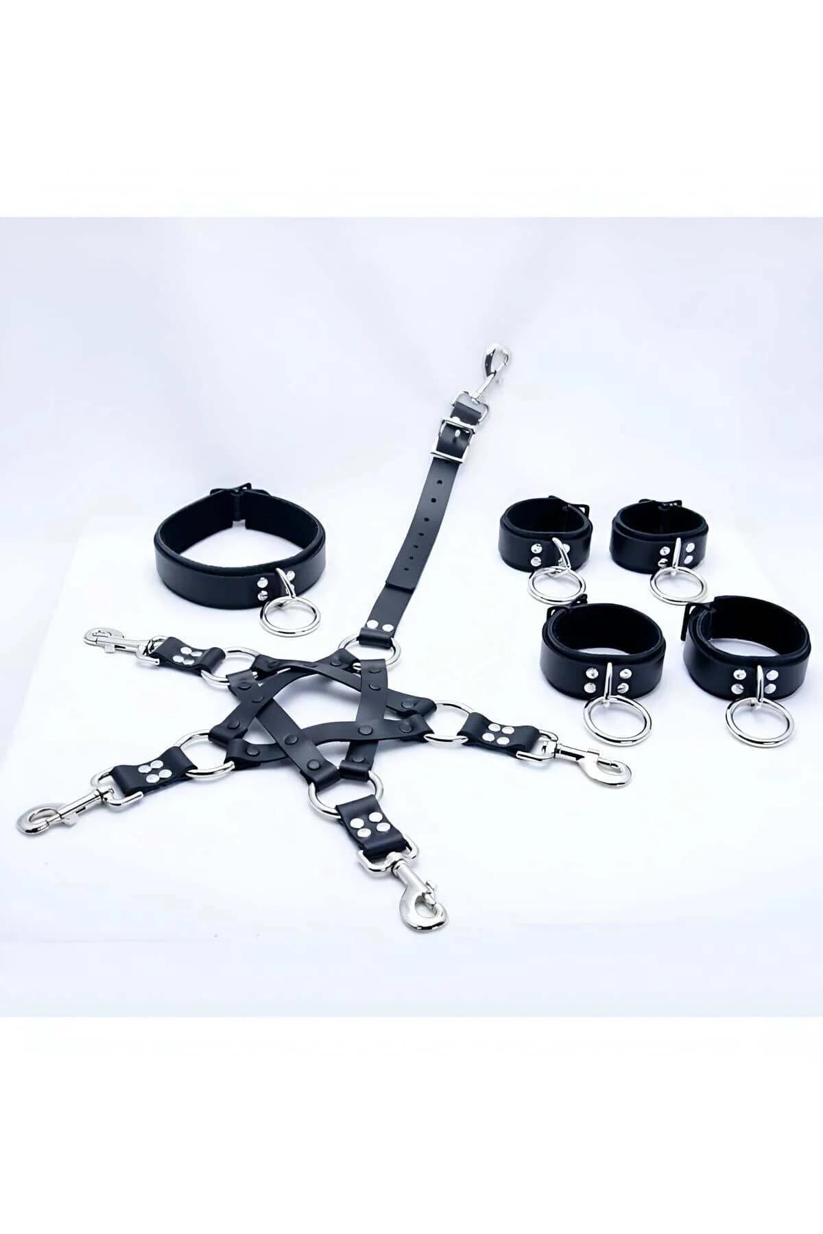 Black faux leather thigh cuff pair with silver O-rings showing buckle closure