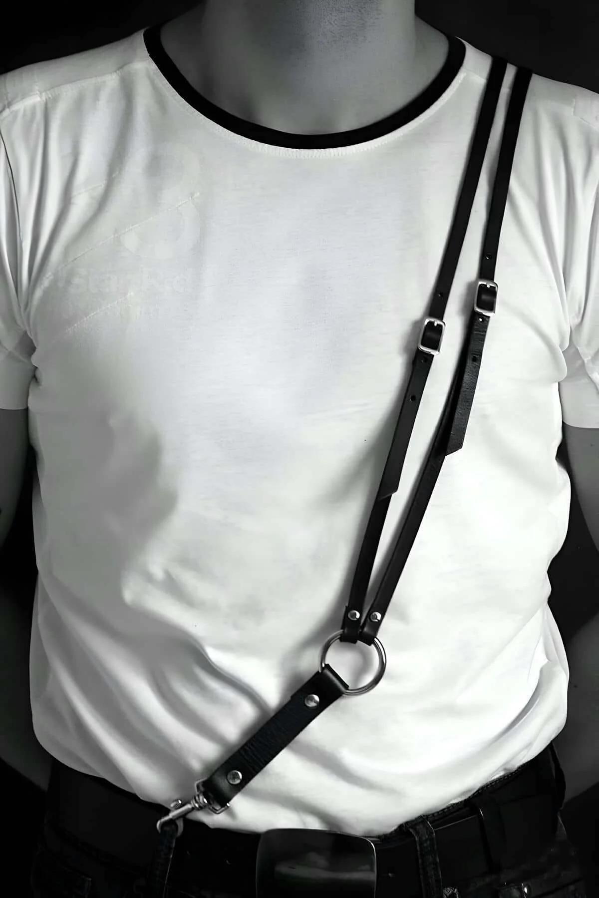adjustable black chest harness O-ring center close-up silver metal hardware detail