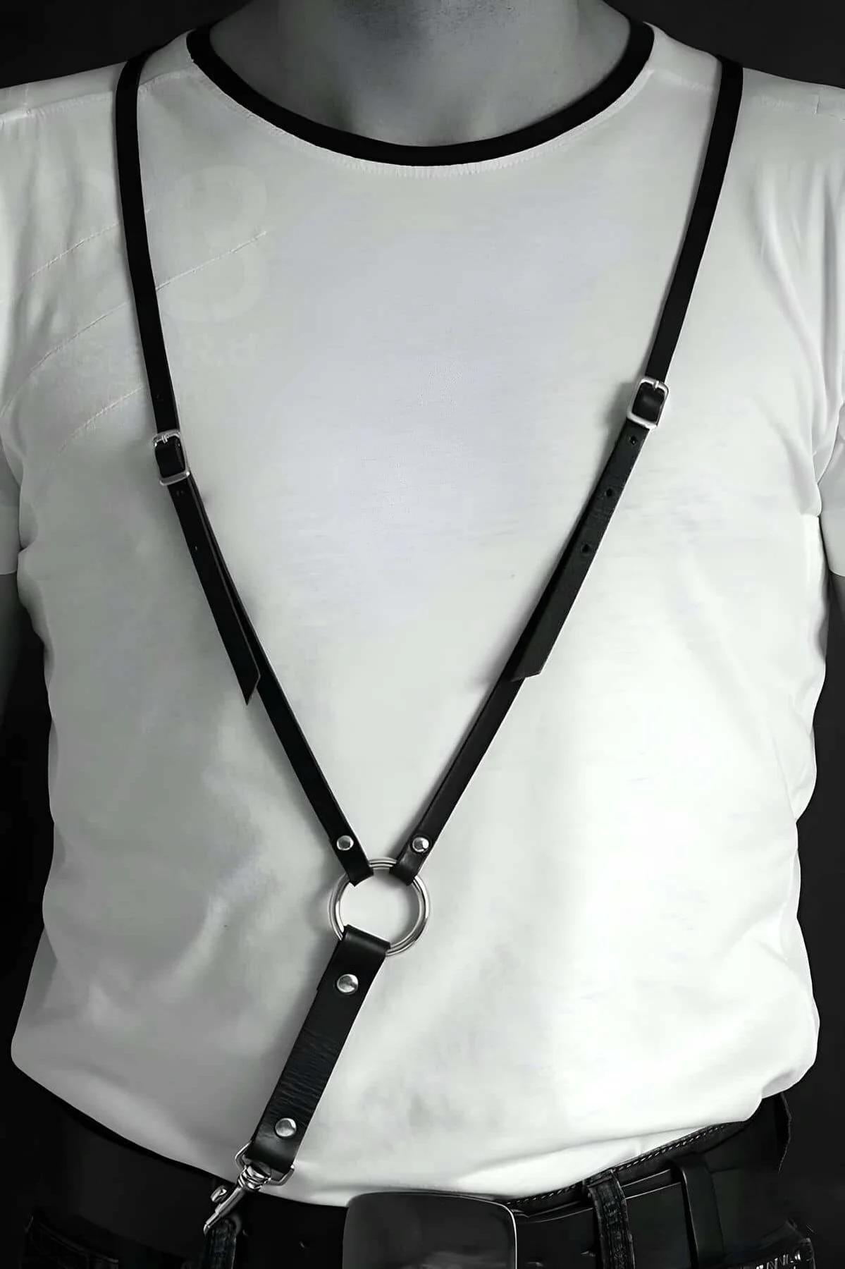 matte black faux leather chest harness straps crossing torso with silver O-ring junction