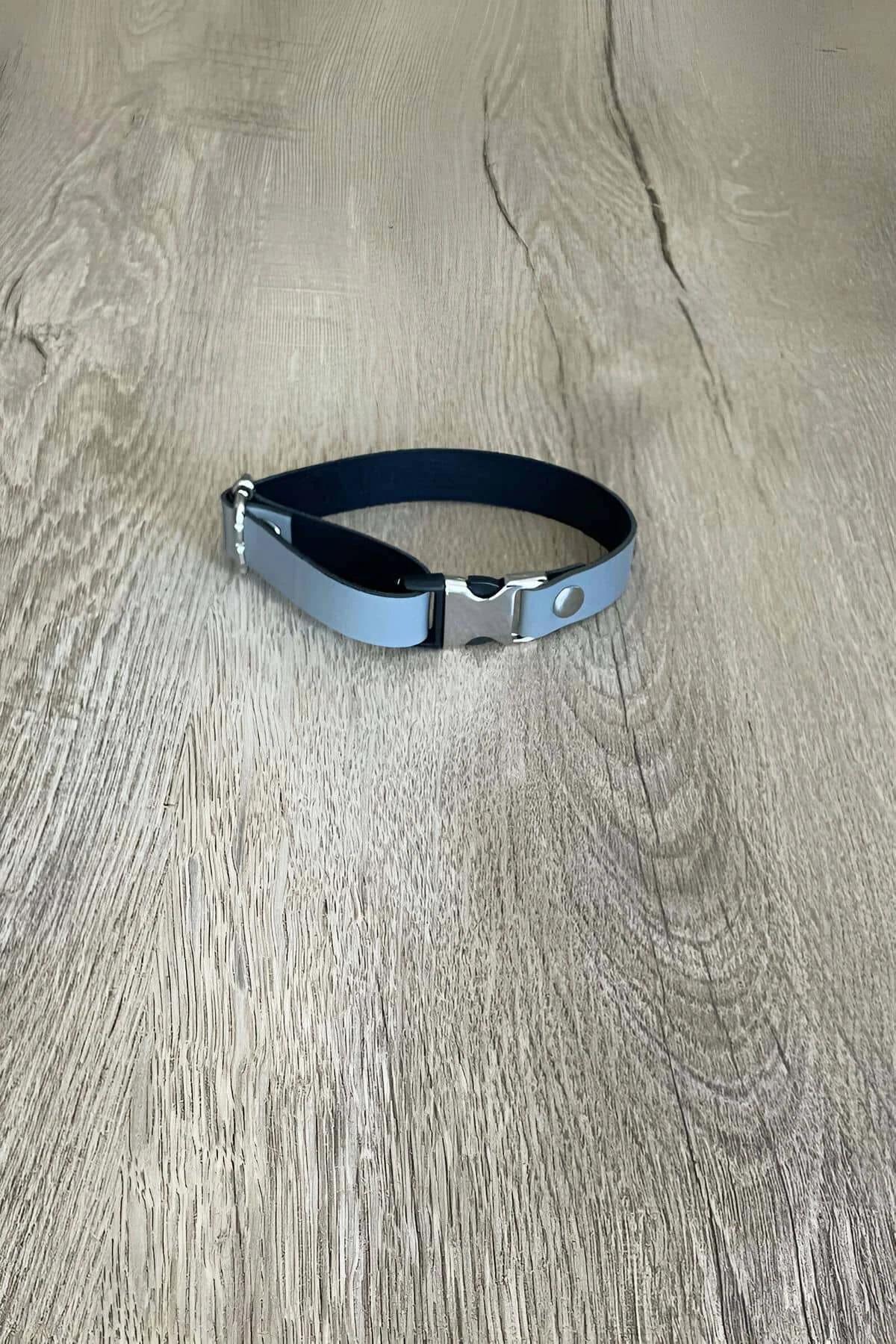 Grey matte vegan leather choker strap laid flat showing 2 cm width and adjustment rivet holes