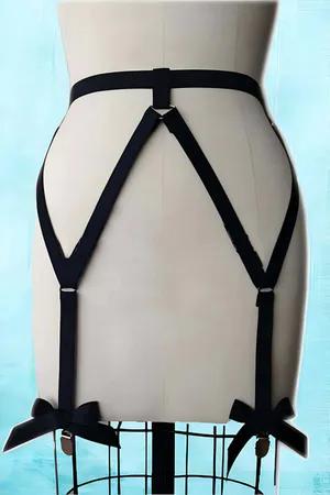 Black adjustable garter harness with decorative bows and metal clips