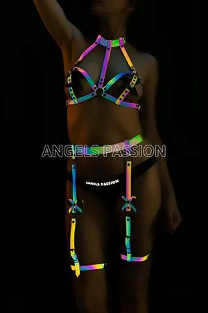 Rainbow reflective full body harness and garter set worn by a model
