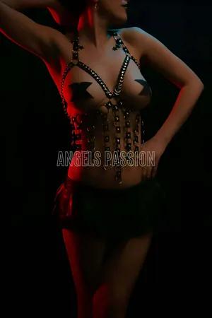Black faux leather body harness with layered O-rings and metal hardware