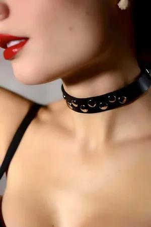Black faux leather choker with silver buckle and strap details