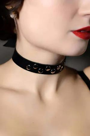 Black faux leather choker with silver buckle and strap details