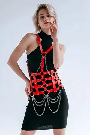 Red faux leather body harness with silver chain detail and adjustable straps