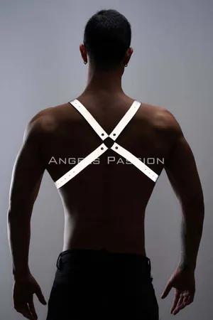 Reflective chest harness with adjustable straps worn by a man