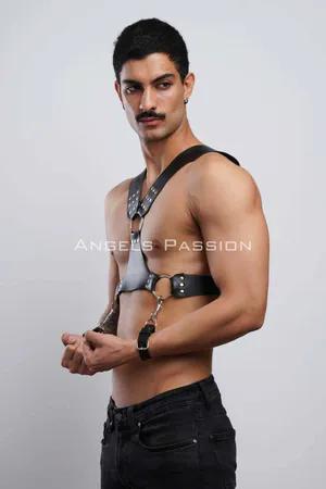 Black faux leather studded chest harness with detachable cuffs
