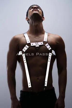 Reflective chest and trouser harness set worn by a person, showing silver straps with reflective elements