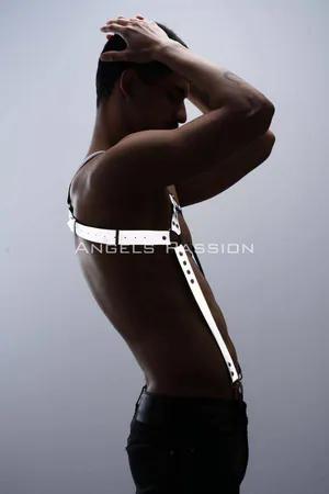 Reflective chest and trouser harness set worn by a person, showing silver straps with reflective elements